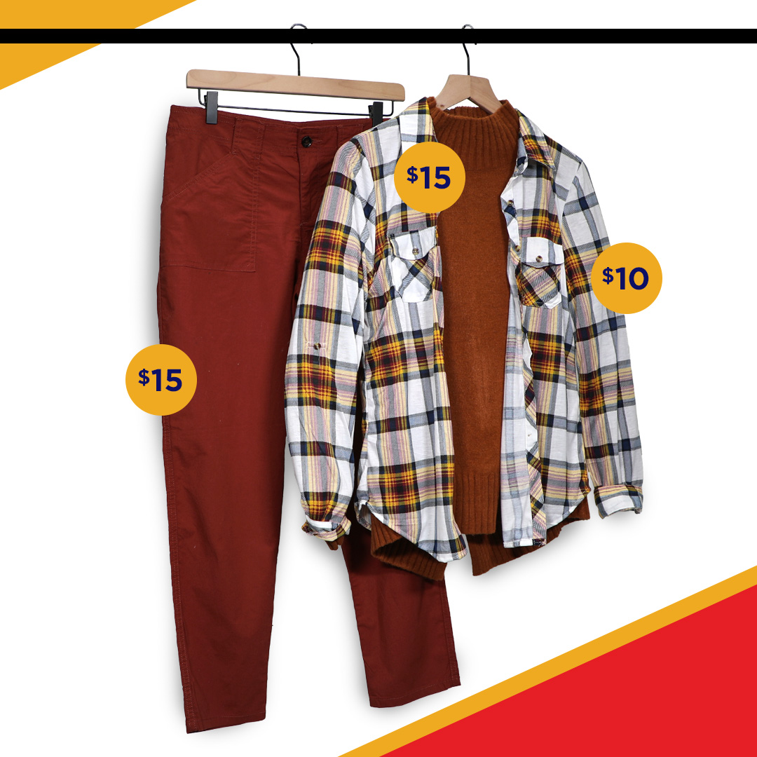 womens fall clothing on clothing rack- orange pants with orange shirt and flannel