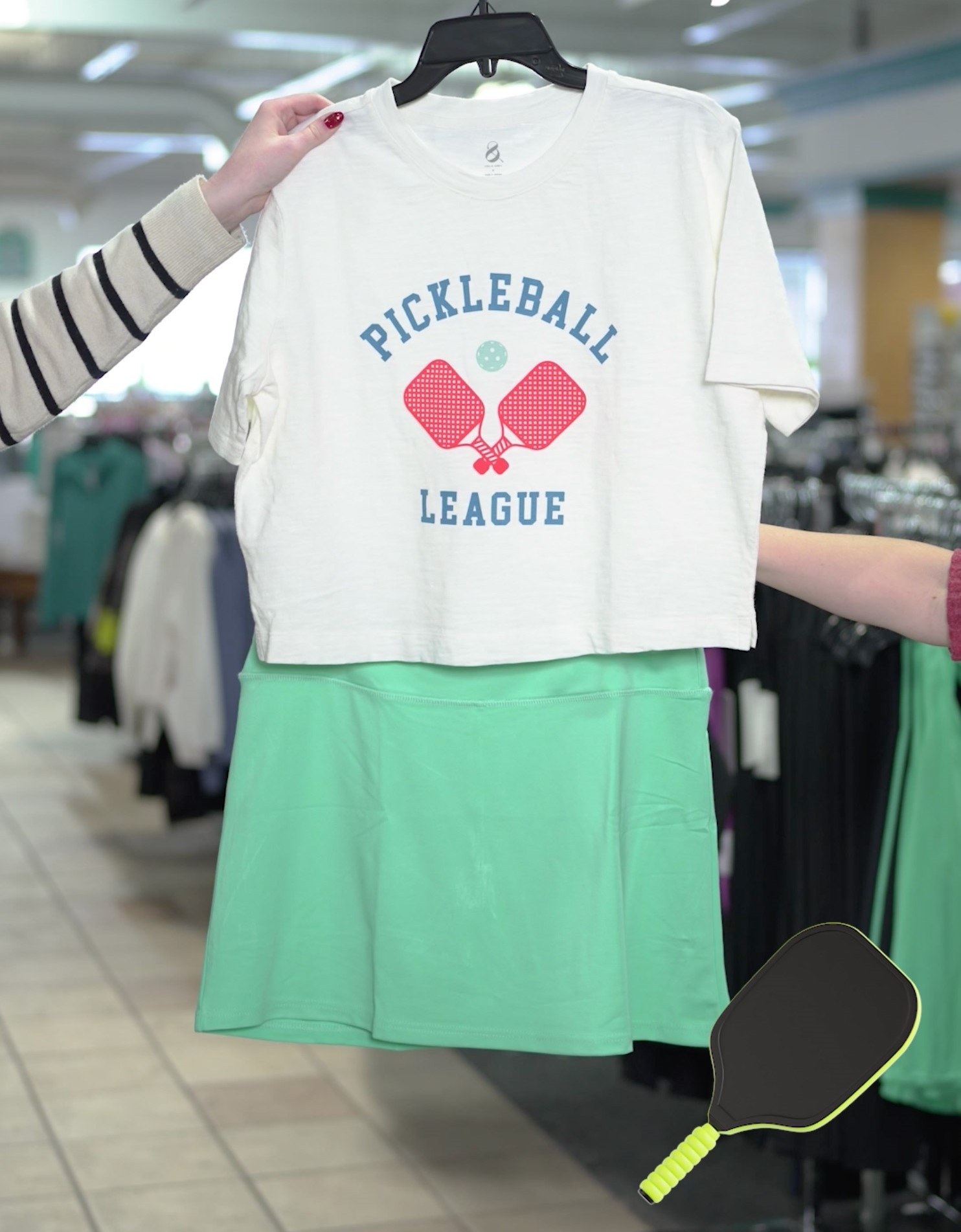 Image of a shirt with the words pickleball and a teal skirt