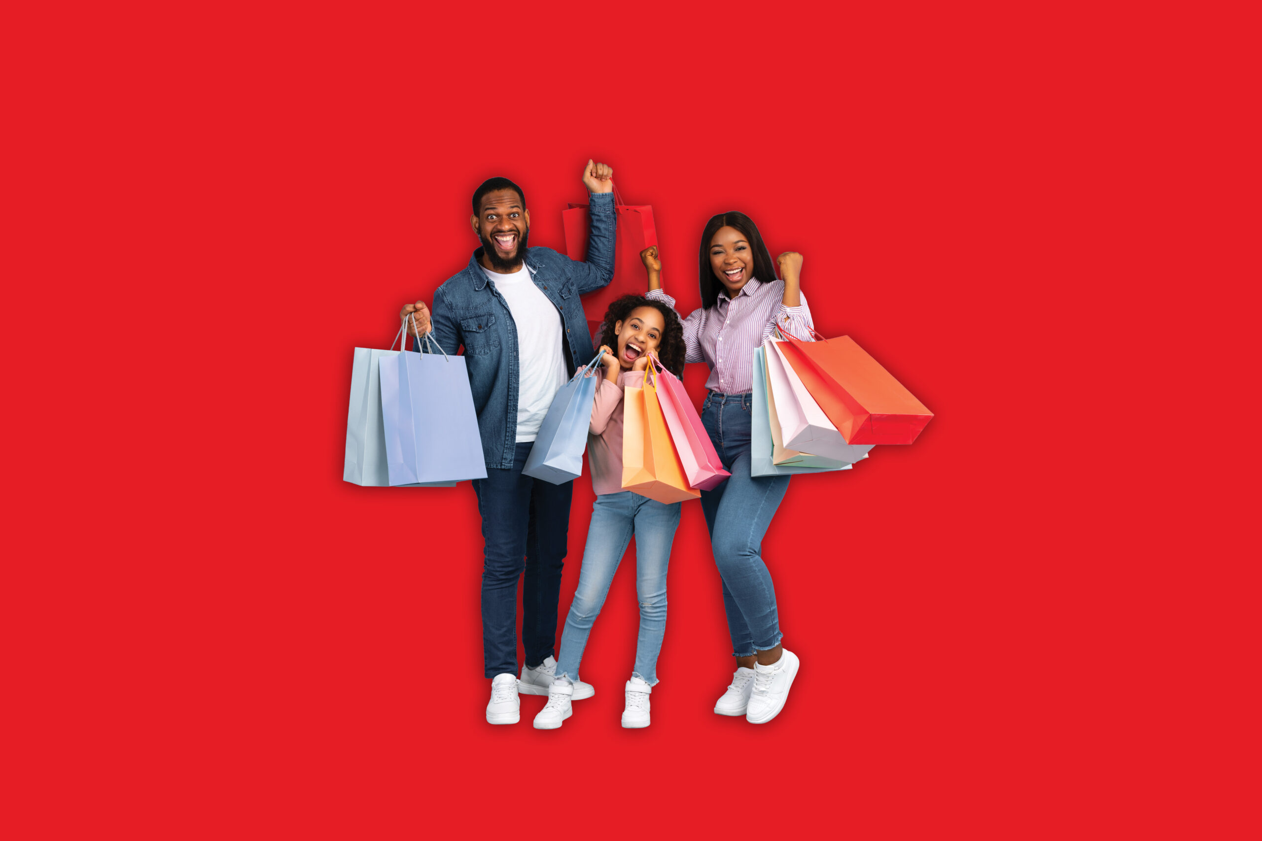 Family holding shopping bags