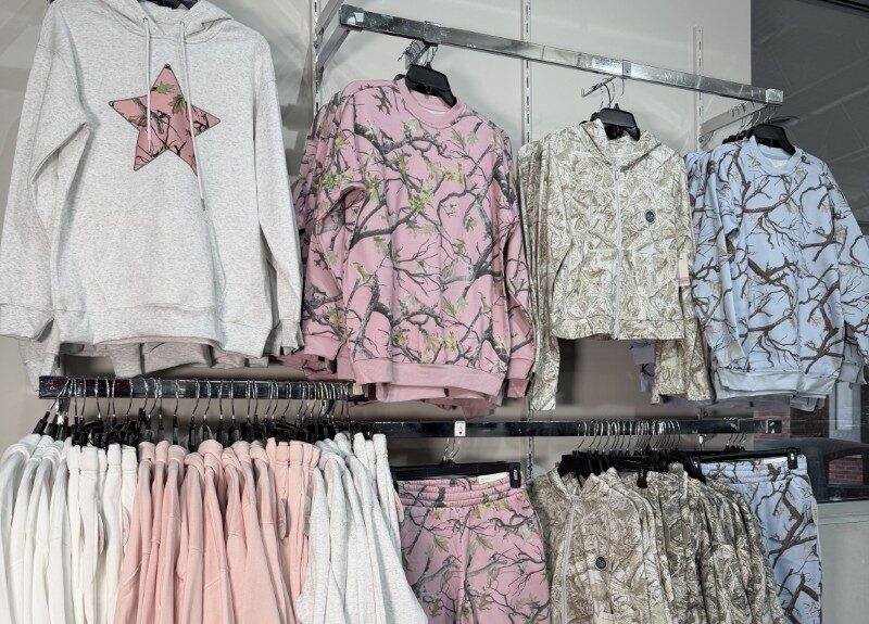 Image of camo clothing hanging on the wall