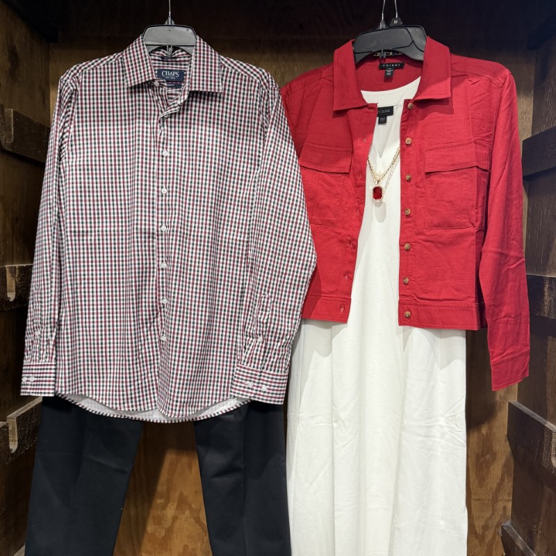 Image of a woman's white dress with a red jacket next to a men's plaid shirt with black pants.